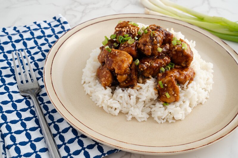 Sesame Chicken with Honey-Ginger Slaw & Sichuan Chili Crisp Green Beans